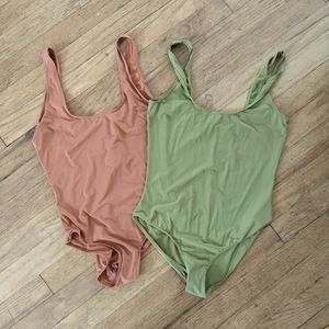 Bundle of 2 Parade body suits, rust and green